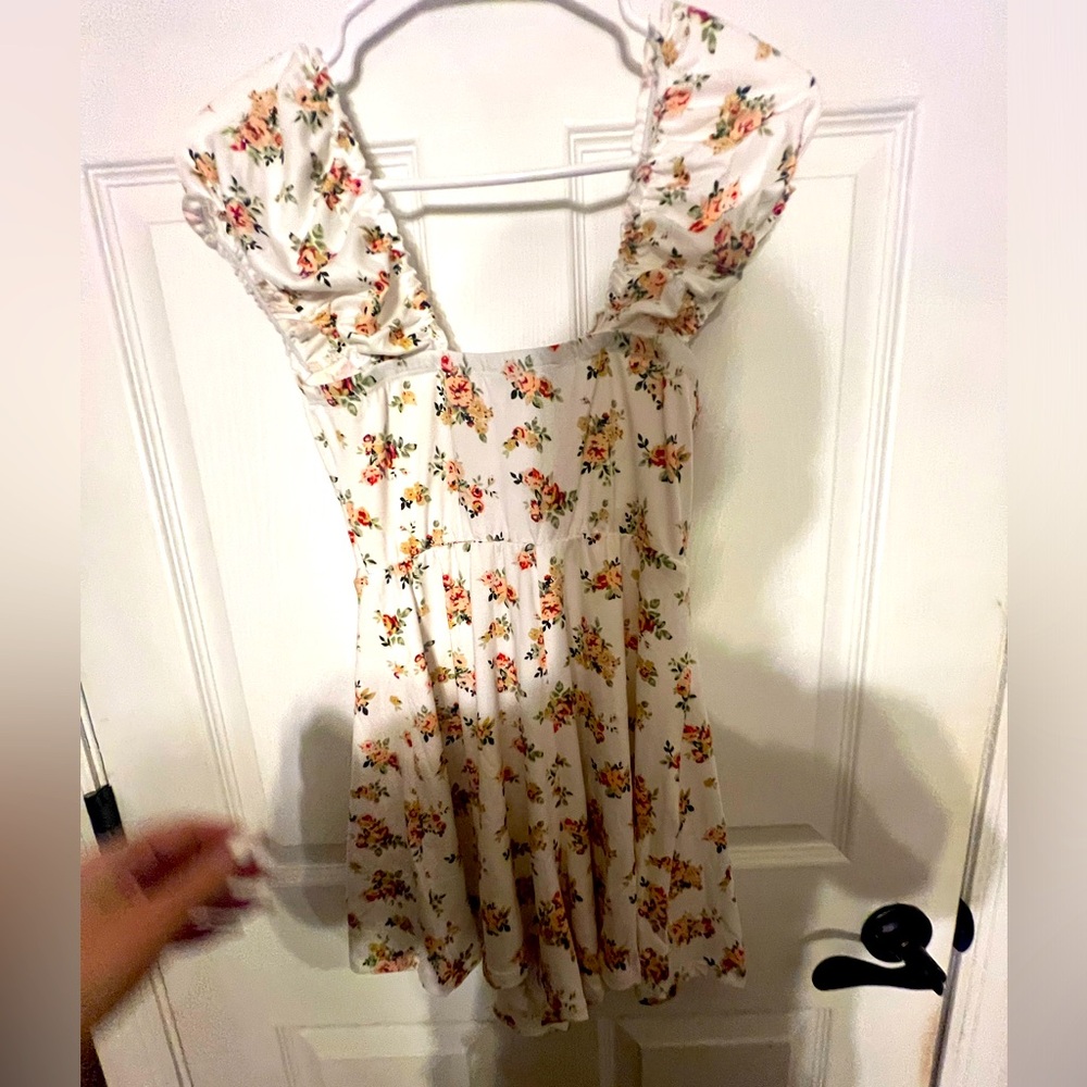 Very cute romper floral detail with a tie on the front brand www.lovetosite.com